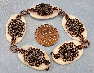 Mother of Pearl and Antique Coppertone Filigree Chain of Beads